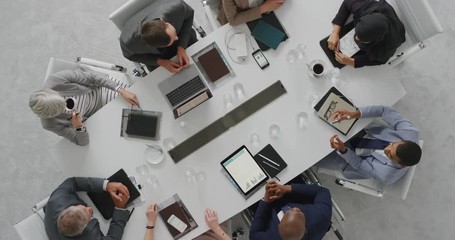 Wall Mural - diverse business people meeting in boardroom corporate leaders collaborating sharing ideas discussing project brainstorming successful strategy top view