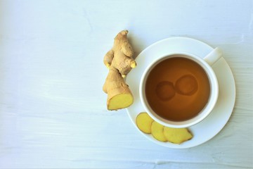 Wall Mural - Cup of Ginger tea  freshly brewed, top view, copy space.