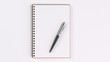© GooD_WiN - Blank notebook with pen on table