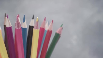 Aufkleber - Colored pencils, rotation 360 degrees. Dark bacground. Macro view.