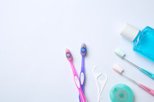 Flat Lay Composition With Manual Toothbrushes And Oral Hygiene Products On White Background
