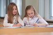 © Evgeny Sumin - student girls are sitting at a Desk