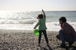 © javiindy - Mother and little girl having fun on the beach in winter