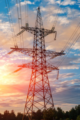 Wall Mural - high-voltage power lines at sunset. electricity distribution station .