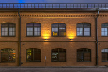 Evening In The Old Quarter. Office Building In Loft Style. Brick Building With Large Windows.