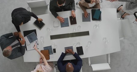 Wall Mural - professional business people meeting in boardroom shaking hands diverse corporate leaders collaborating sharing ideas planning development strategy top view
