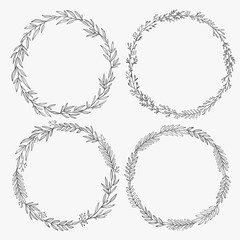 Wall Mural - Hand drawn wreaths vector. Romantic floral design element. Floral circle frames made of branches, leaves, twigs. 