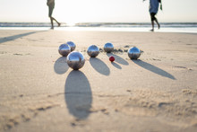 Petanque Balls On Sandy Beach