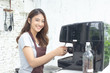 © Bavorndej - Asian Women Barista smiling and looking to camera in coffee shop counter. Barista female working at cafe. Working woman small business owner or sme concept. Vintage tone.
