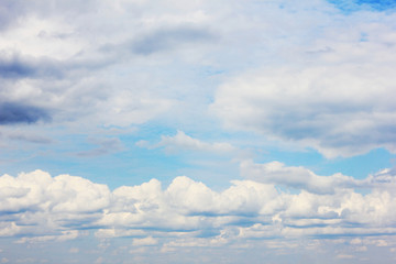 clouds in blue sky summer nature wallpaper. fluffy sky background cloudscape with many stormy clouds
