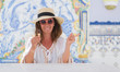 © Krakenimages.com - Middle age brunette woman eating ice cream very happy pointing with hand and finger to the side