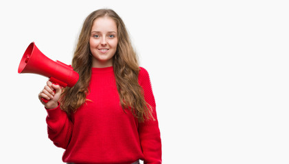 Sticker - Young blonde woman holding red megaphone with a happy face standing and smiling with a confident smile showing teeth