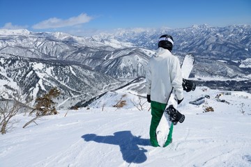 Panoramic snow boarding at hakuba happo in Nagano Japan with blue