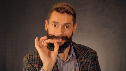 Leinwandbilder - bearded hipster shows sign approval