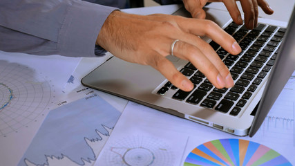 Poster - unrecognizable business man entering data on computer