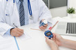 © Proxima Studio - Doctor and patient diabetes consultation in office or clinic.