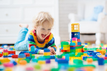 Child Playing With Toy Blocks. Toys For Kids.
