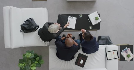 Wall Mural - top view business people meeting sharing proposal signing contract deal for startup company in trendy modern lobby