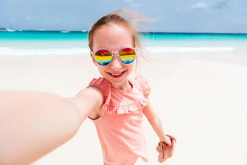 Sticker - Adorable little girl at beach