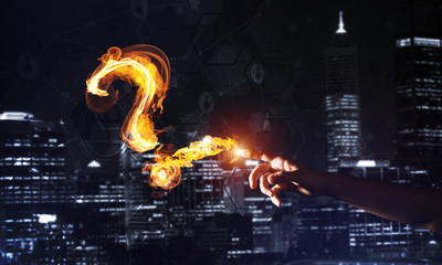 Aufkleber - Concept of help or support with fire burning question mark against night city background