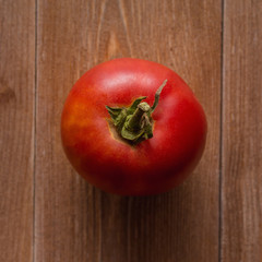 Wall Mural - Beautiful red tomatoes on wooden background, top view