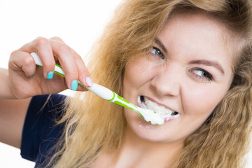 Wall Mural - Woman brushing cleaning teeth