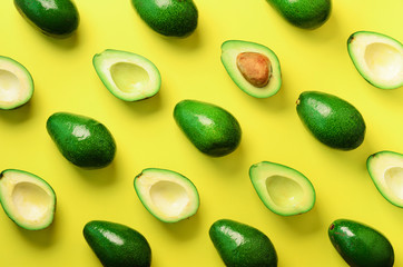 Wall Mural - avocado pattern on yellow background. top view. banner. pop art design, creative summer food concept