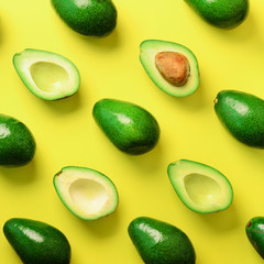 Wall Mural - avocado pattern on yellow background. top view. banner. pop art design, creative summer food concept