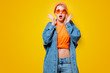 © Masson - Young style girl in jeans clothes with orange glasses on yellow background. Clothes in 1980s style