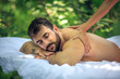 © liderina - Beck massage at nature. Young men.