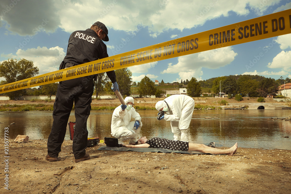 Woman body in black apparel found drowned near summer river bank in city Stock Photo | Adobe Stock