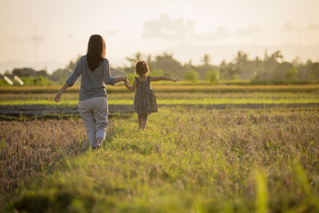 Wall Mural - mom and kid exploring nature