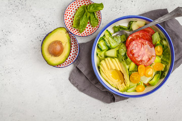 Wall Mural - Green zucchini noodles salad with tomatoes, avocado and basil. Healthy vegan zucchini pasta.