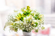 canvas print picture - Closeup of flower bouquet in front of bright sunny window in room of hotel, many flowers arrangement