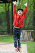 joyful boy jumping into the air