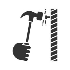 Wall Mural - Hand hammering nail glyph icon