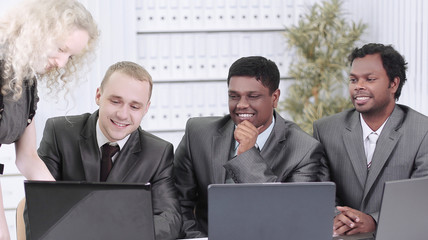 business team discussing business issues sitting at their Desk