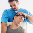 © Microgen - Physiotherapist Working With Patient Neck