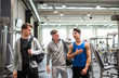 © Halfpoint - Young friends in modern crossfit gym, greeting each other.
