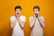 © Drobot Dean - Portrait of a two surprised young men best friends