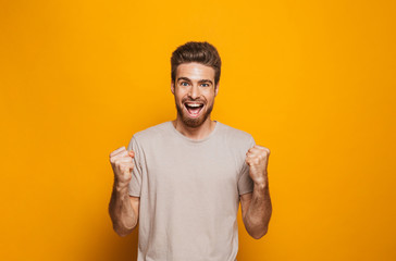 Portrait of a happy young man celebrating success