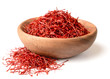 saffron thread in the wooden plate, isolated on the white background.