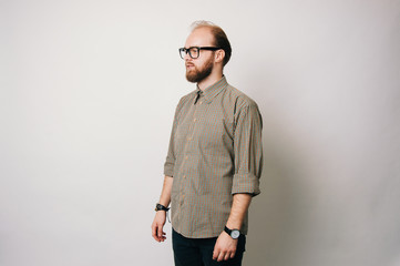 Wall Mural - Portrait of young bearded man wearing glasses