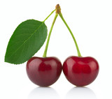 Fototapeta  - Ripe red cherry berries with green leaves isolated on white