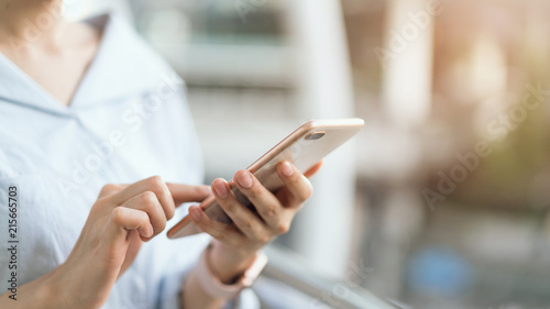 Cuadros en Lienzo woman using smartphone on staircase in public areas, During leisure time
