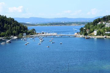 Oslo, Norway - July 22, 2018: View to Oslo Fjord. Two islands Ormoya and Malmoya connected to the mainland by bridge, just east of the city center.