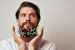 © SHOTPRIME STUDIO - cute man with flowers in beard portrait