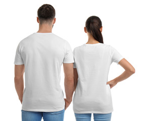 Wall Mural - Young couple in t-shirts on white background. Mockup for design