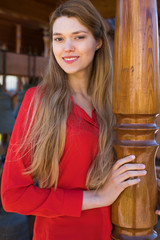 Wall Mural - Beautiful young blonde girl in red blouse. Street fashion look.