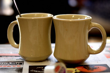 White Mug of Coffee On A Table In A Diner In The Morning For Breakfast.